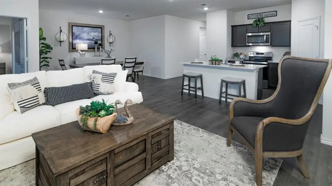 Open-concept living space featuring wood-finish flooring