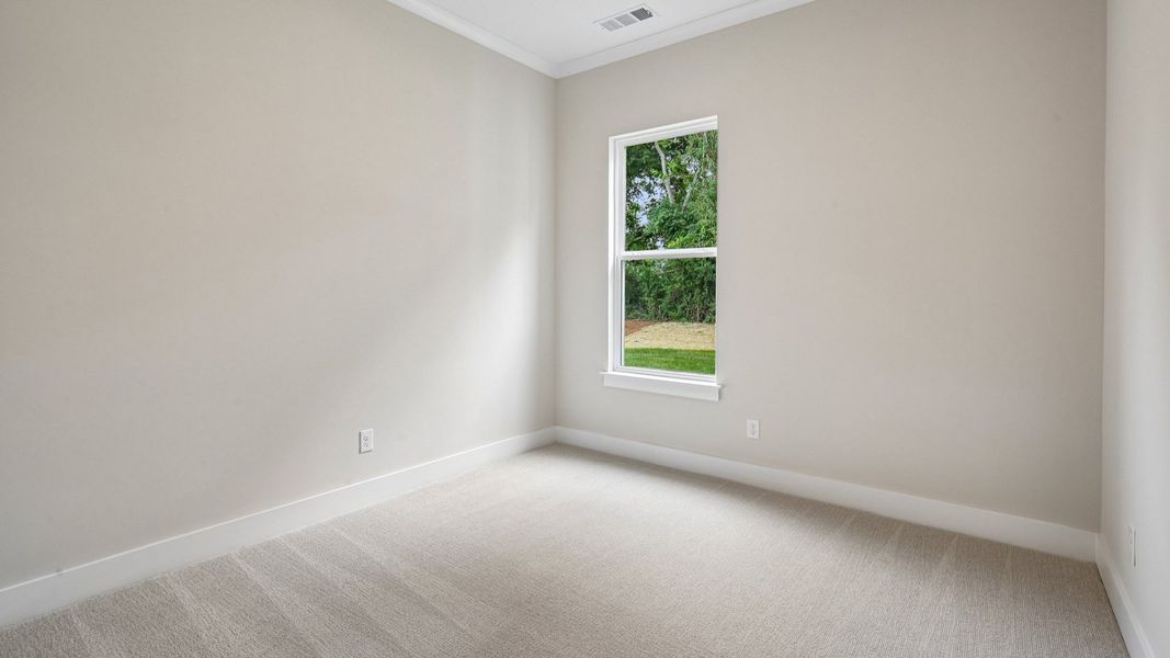 Bedroom with carpet and window Bedroom with carpet and window