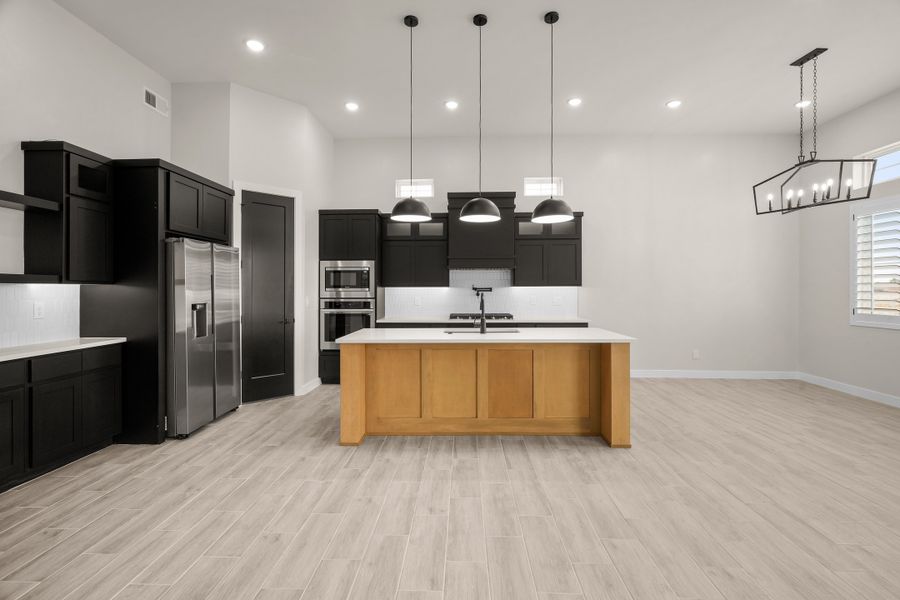 Representative furnished interior of a home built from the Pebble Beach- II by LEH. Homes in Verdancia, El Paso (Image 9).