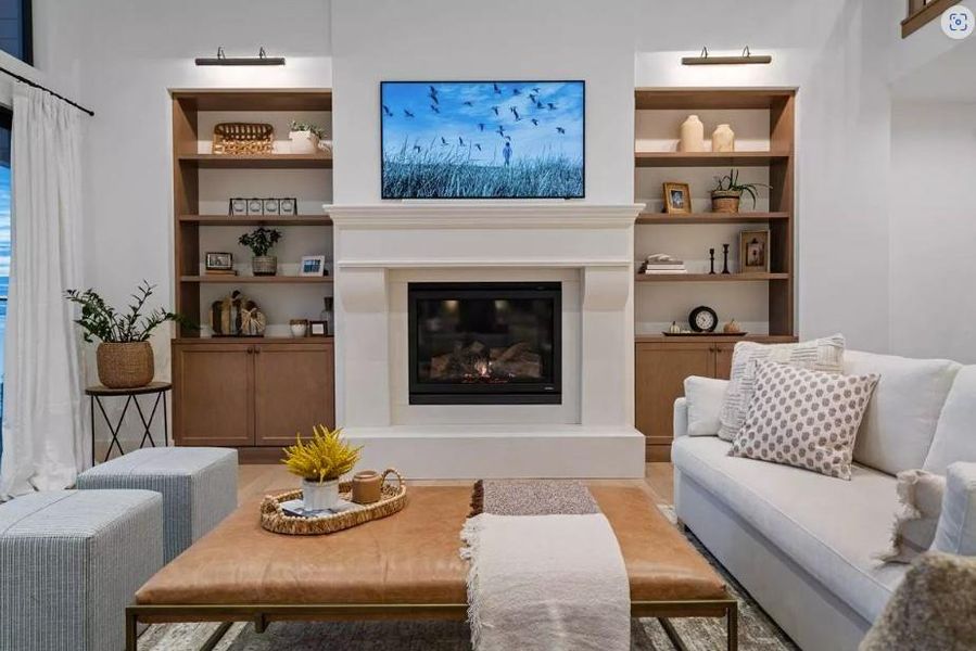 Living room Cast Stone Wood Burning Fireplace and Custom Built-in Bookcases