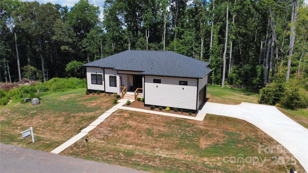 Front exterior of a new home in , Bessemer City, NC, highlighting curb appeal (Image 2). Front exterior of a new home in , Bessemer City, NC, highlighting curb appeal (Image 2).