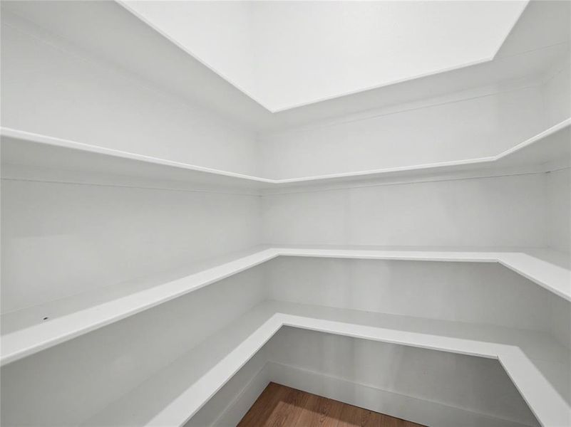 Built-in shelving with multiple tiers and white finishes Built-in shelving with multiple tiers and white finishes