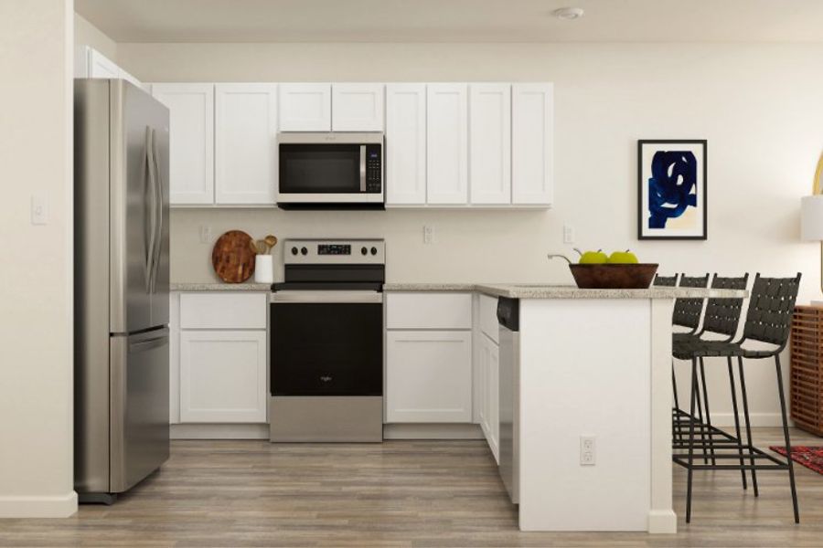 A kitchen with white cabinets. A kitchen with white cabinets.