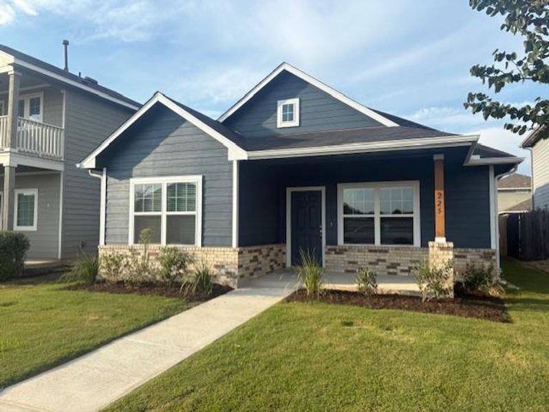 Front exterior of a new home in Brooklands, Hutto, TX, highlighting curb appeal (Image 2). Front exterior of a new home in Brooklands, Hutto, TX, highlighting curb appeal (Image 2).