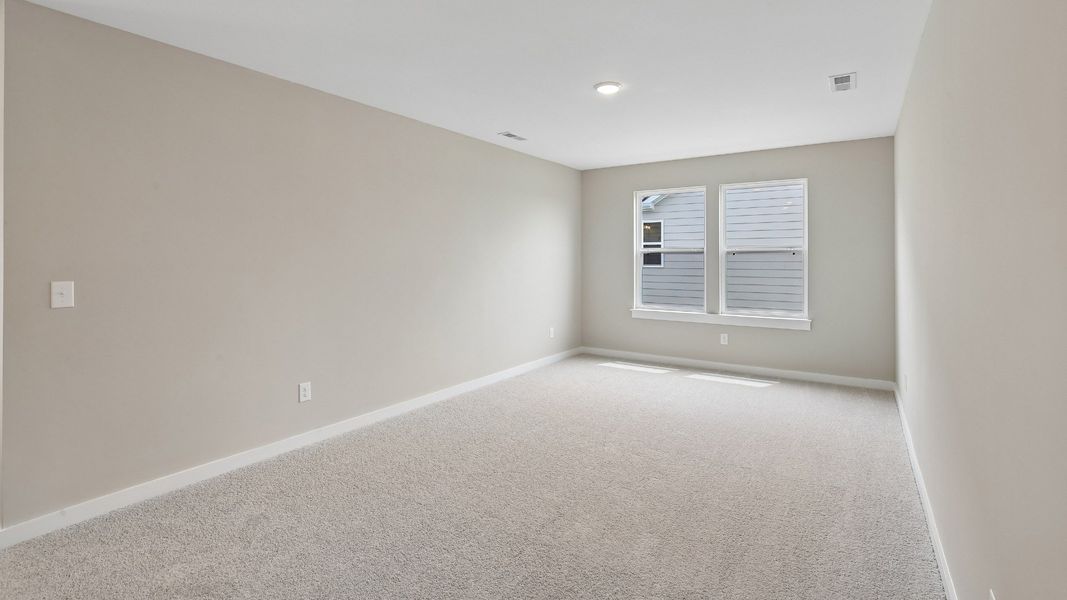 Second Floor Loft area with windows and carpet