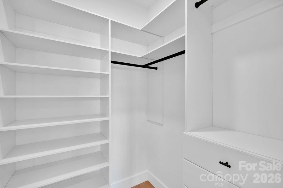 Primary Bedroom - Walk in Closet with custom wood  shelving