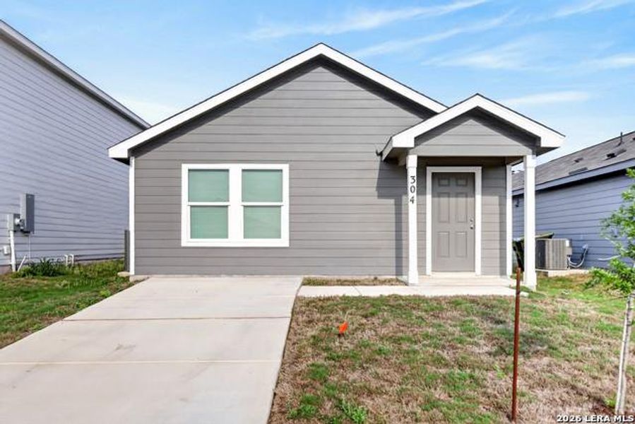A welcoming facade with a covered entry and clean lines awaits your personal touch. A welcoming facade with a covered entry and clean lines awaits your personal touch.