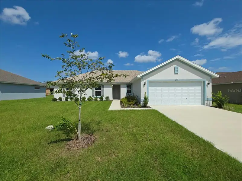 Front exterior of a new home in , Citrus Springs, FL, highlighting curb appeal (Image 14).