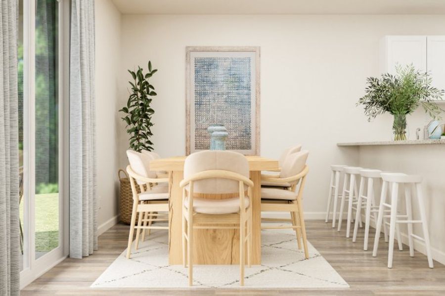 A dining room table with chairs.