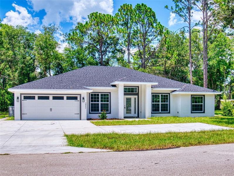 Front exterior of a new home in , Inverness, FL, highlighting curb appeal (Image 29).