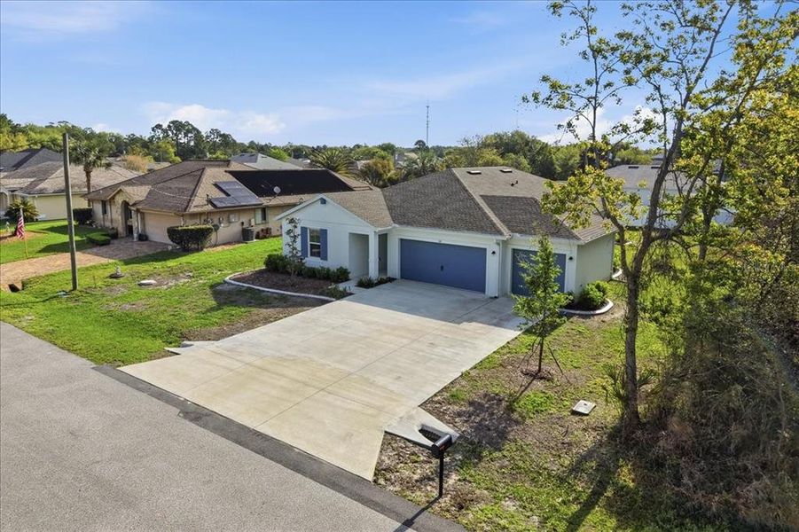 Front exterior of a new home in Aspire at Palm Coast, Palm Coast, FL, highlighting curb appeal (Image 26).