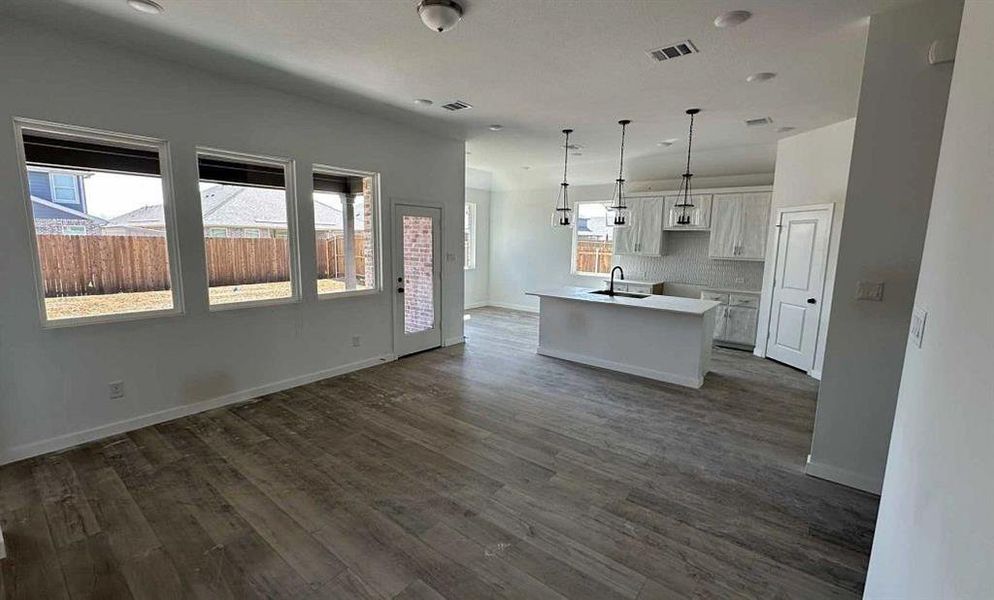 Open Kitchen-Living-Dining Room Construction Progress featuring the Harmony Collection