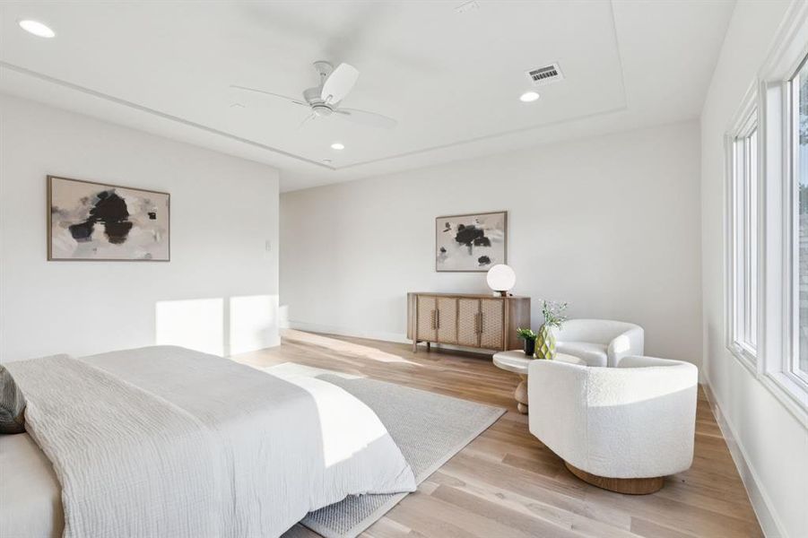Bedroom with light wood-style flooring, recessed lighting, and a ceiling fan