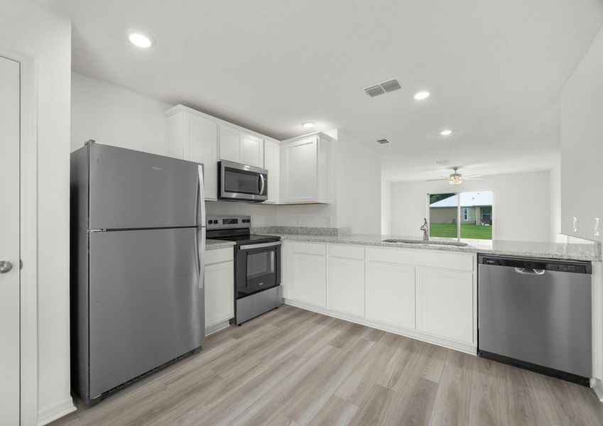 The kitchen overlooks the family room. The kitchen overlooks the family room.