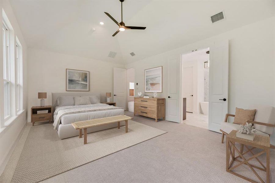 Carpeted bedroom featuring vaulted ceiling and ceiling fan Carpeted bedroom featuring vaulted ceiling and ceiling fan