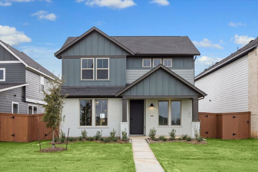 Front exterior of a new home in Elyson, Katy, TX, highlighting curb appeal (Image 20).