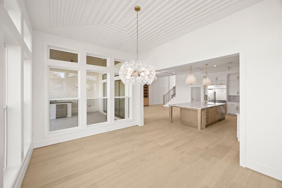 The dining space is tucked to the side but still in the mix!