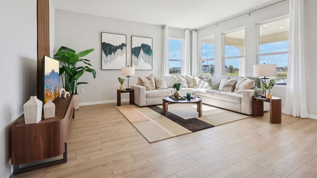 Representative furnished interior of a home built from the Robinson by D.R. Horton in Harmony West, St. Cloud (Image 4).
