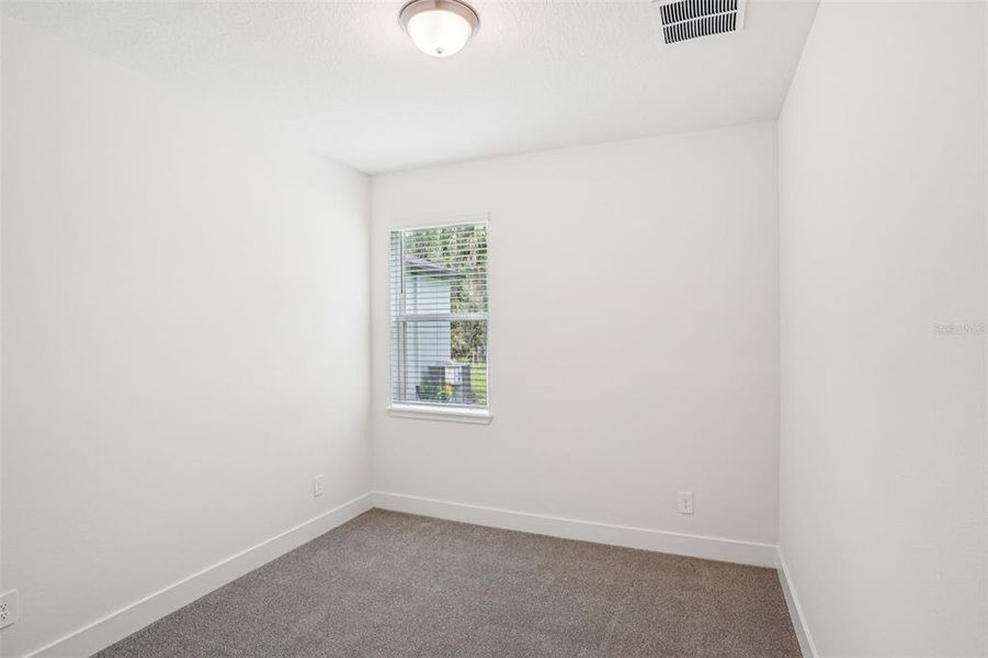 Spacious, unfurnished interior of a new home in Ridgehaven - Signature Series, Ormond Beach (Image 48).