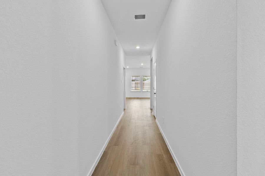 Spacious, unfurnished interior of a new home in The Canopies, Splendora (Image 11).