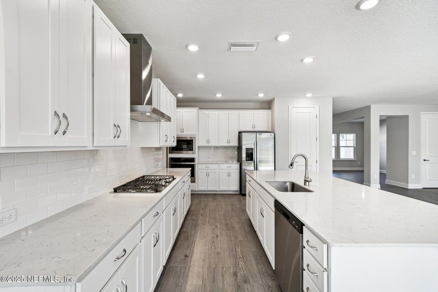 Furnished interior view inside a new home in Tributary 70', Yulee (Image 8).