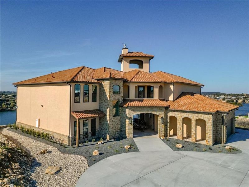 Mediterranean / spanish-style home with a water view and a carport Mediterranean / spanish-style home with a water view and a carport