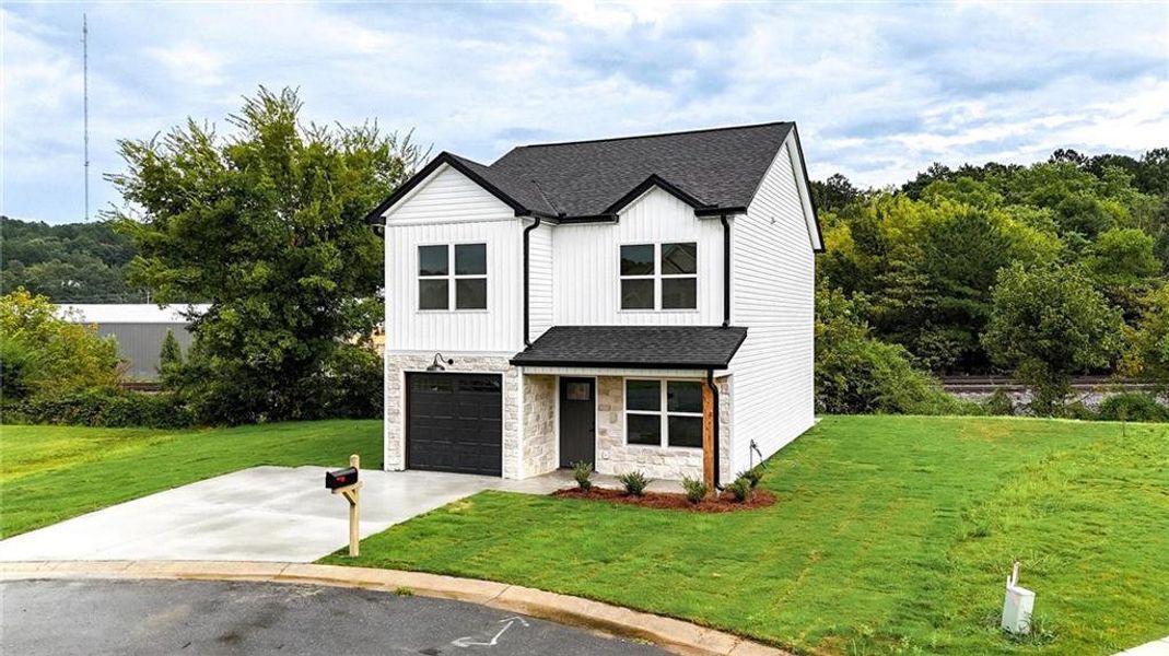 Front exterior of a new home in , Calhoun, GA, highlighting curb appeal (Image 22).