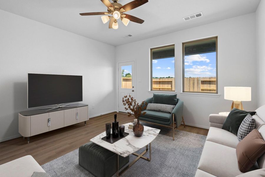 Your family room has ample space to entertain family and friends. This space features beautiful floors, fresh paint, ceiling fan with lighting, and high ceilings. Your family room has ample space to entertain family and friends. This space features beautiful floors, fresh paint, ceiling fan with lighting, and high ceilings.