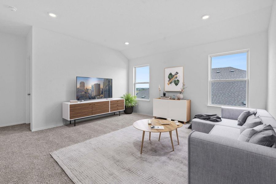 Living area featuring carpet floors, recessed lighting, and lofted ceiling Living area featuring carpet floors, recessed lighting, and lofted ceiling