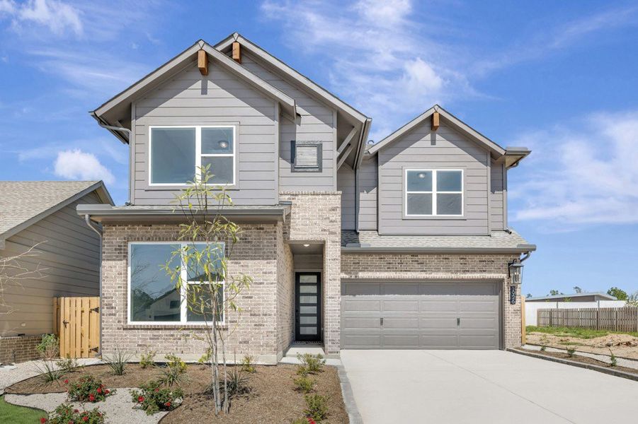 Representative exterior photo of a completed home built from the The Mesquite by David Weekley Homes in COLTON - Reserve Collection, Montgomery, TX (Image 1). Representative exterior photo of a completed home built from the The Mesquite by David Weekley Homes in COLTON - Reserve Collection, Montgomery, TX (Image 1).