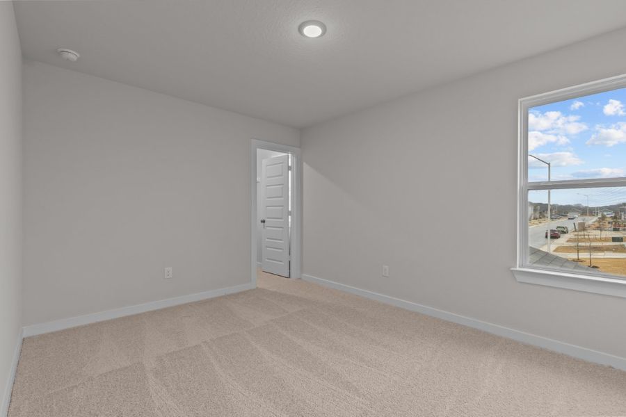 A room with a window and a door.