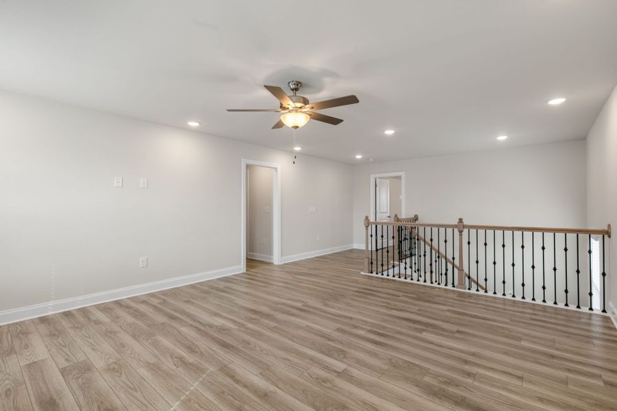 Loft - shown w/ enhanced vinyl plank flooring and open rails Loft - shown w/ enhanced vinyl plank flooring and open rails