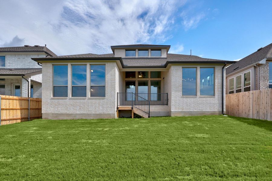 Front exterior of a new home in Lakeside at Tessera - 50', Lago Vista, TX, highlighting curb appeal (Image 16). Front exterior of a new home in Lakeside at Tessera - 50', Lago Vista, TX, highlighting curb appeal (Image 16).