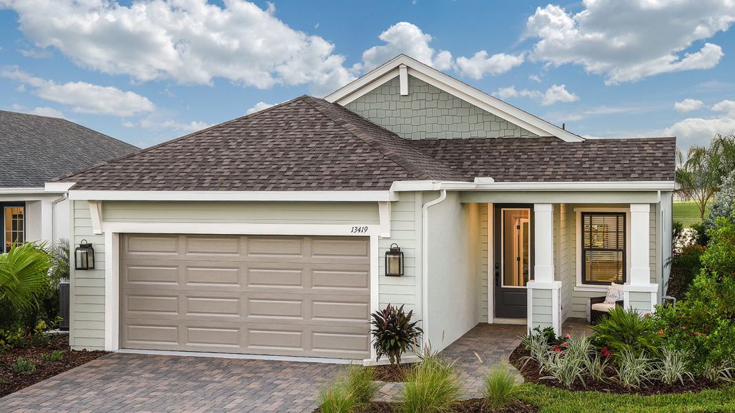 Front exterior of a new home in Canoe Creek, Parrish, FL, highlighting curb appeal (Image 20).