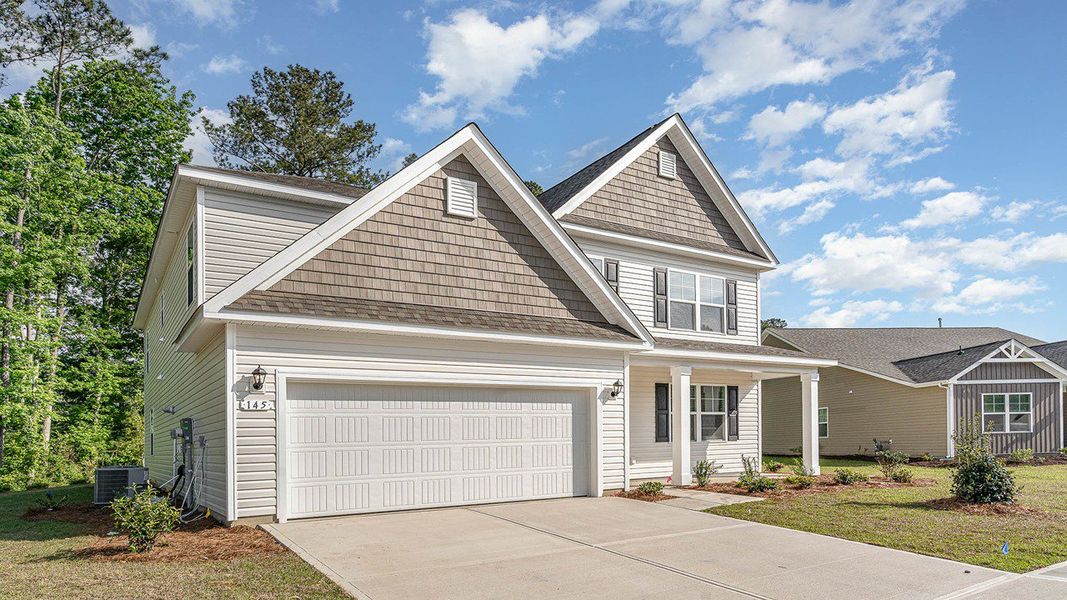 Representative exterior photo of a completed home built from the HARBOR OAK by D.R. Horton in Haven View, Murrells Inlet, SC (Image 18).