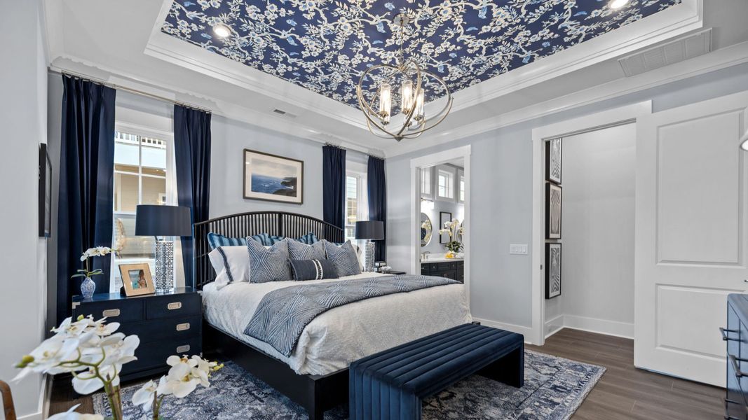 The Adventurer Plan by DBR Homes luxury primary suite with coffered ceilings in Fort Mill, SC.