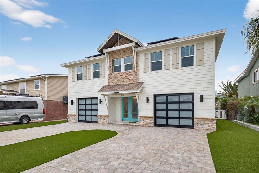 Front exterior of a new home in , Indian Rocks Beach, FL, highlighting curb appeal (Image 29).