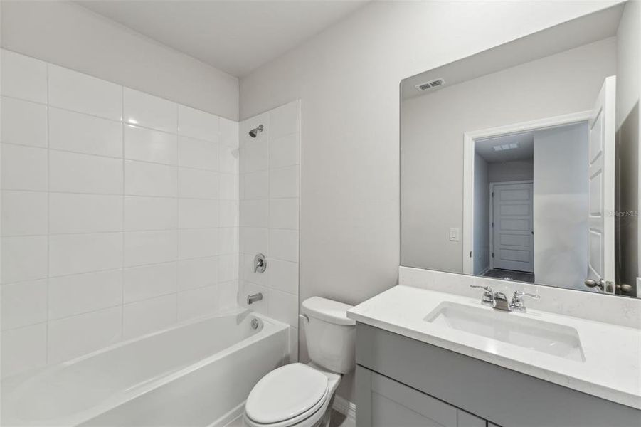 Furnished interior view inside a new home in Crescent Lakes - Premier Series, Punta Gorda (Image 5).