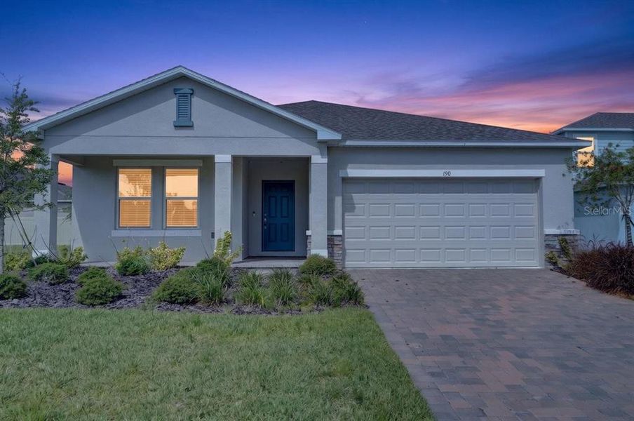 Front exterior of a new home in Riverfront, Edgewater, FL, highlighting curb appeal (Image 28). Front exterior of a new home in Riverfront, Edgewater, FL, highlighting curb appeal (Image 28).