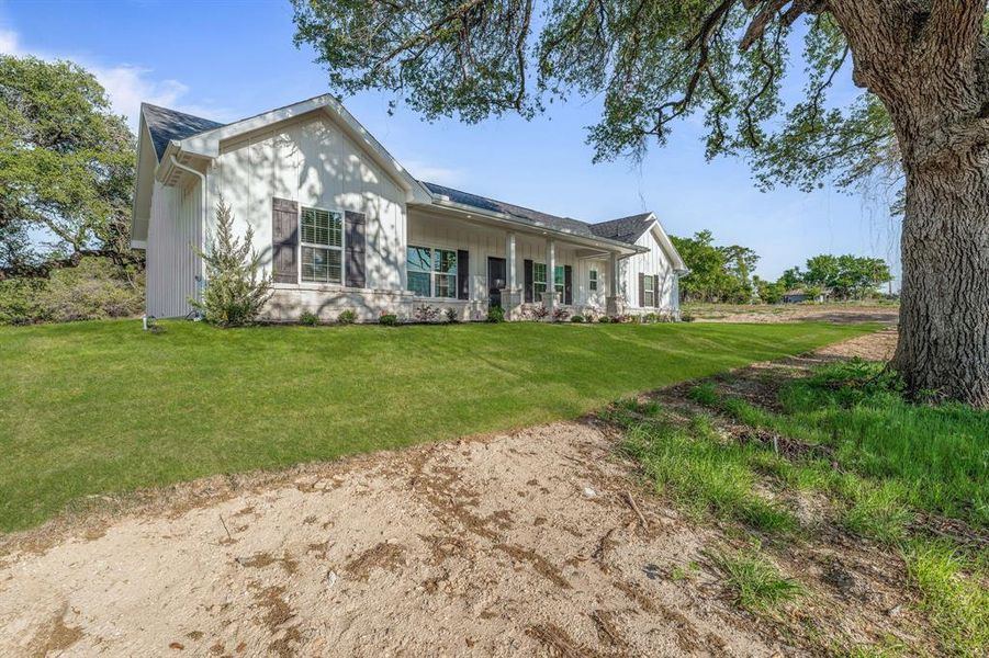 Front exterior of a new home in , Poolville, TX, highlighting curb appeal (Image 18).