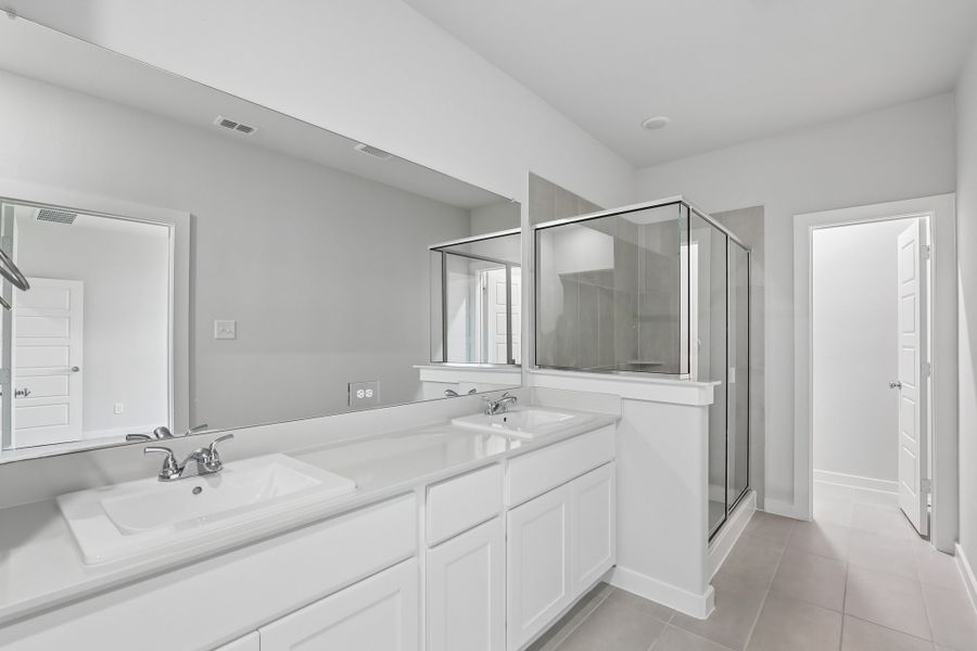 Primary Bathroom in the Holden home plan by Trophy Signature Homes