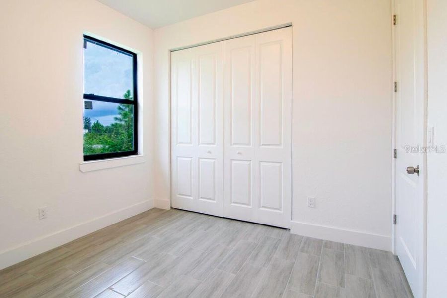 Spacious, unfurnished interior of a new home in , Port Charlotte (Image 21).