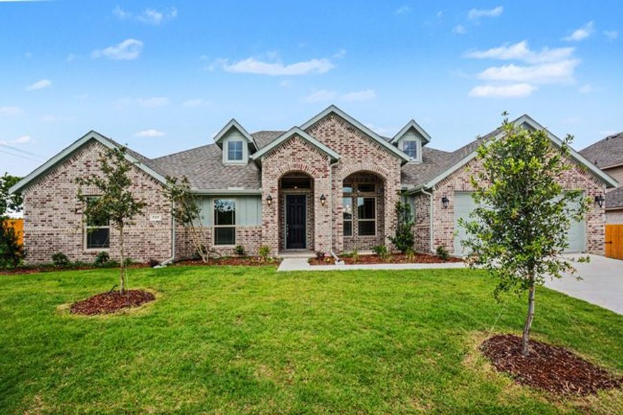 Front exterior of a new home in Cole Crossing Estates, DeSoto, TX, highlighting curb appeal (Image 17). Front exterior of a new home in Cole Crossing Estates, DeSoto, TX, highlighting curb appeal (Image 17).