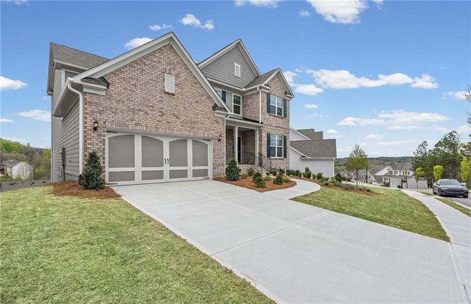 Front exterior of a new home in Sierra Creek, Hoschton, GA, highlighting curb appeal (Image 29).