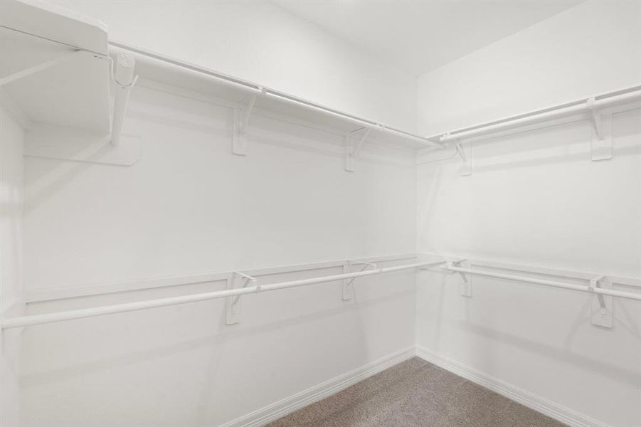 A view of your large primary walk-in Closet