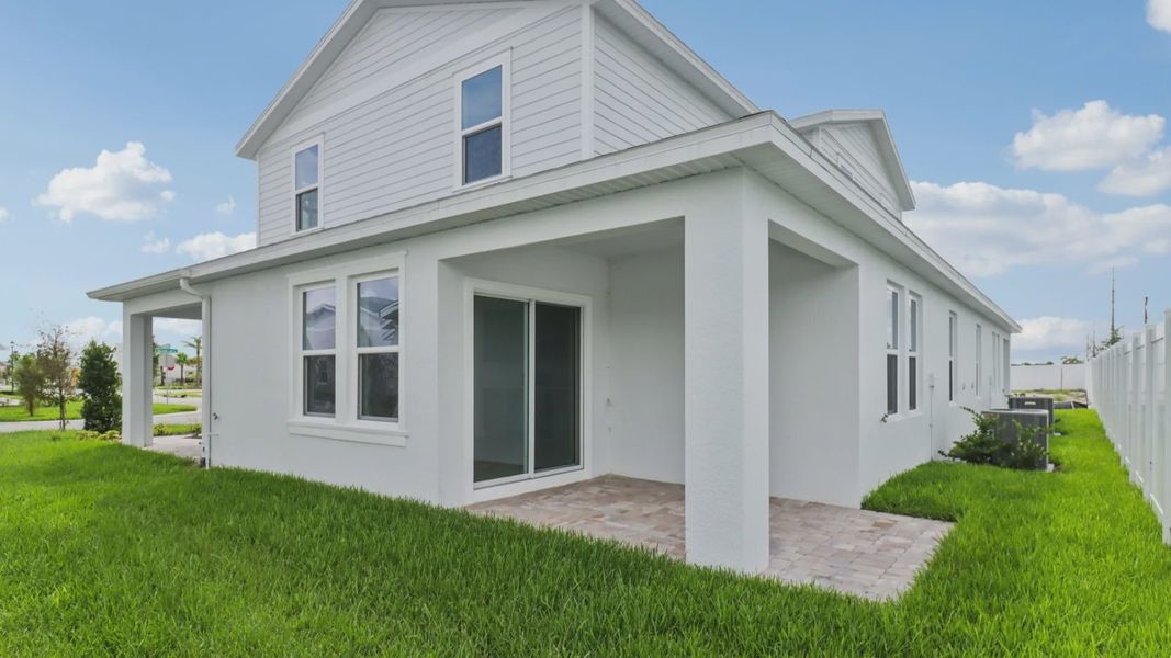 Exterior Back Monterey - End Townhome by DRB Homes at Cyrene at Harmony in St Cloud FL