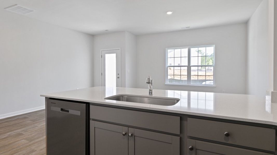 Furnished interior view inside a new home in The Townes at Bexford, Willow Spring (Image 2).