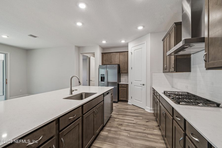 Furnished interior view inside a new home in Tributary 70', Yulee (Image 4).