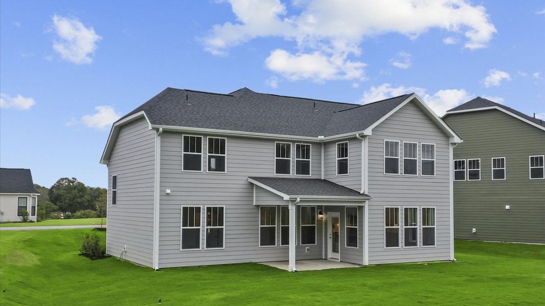 Rear covered porch offers a private, first-rate setting for outdoor enjoyment
