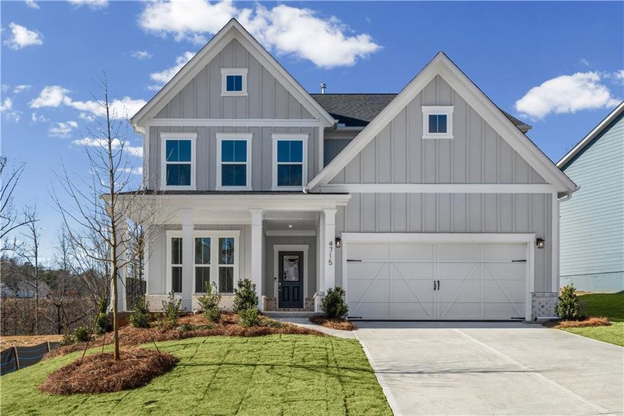Front exterior of a new home in Hunters Creek, Flowery Branch, GA, highlighting curb appeal (Image 1). Front exterior of a new home in Hunters Creek, Flowery Branch, GA, highlighting curb appeal (Image 1).